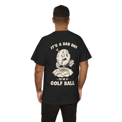 Vintage cartoon design of a beat-up golf ball with a cast, swollen eye, IV bag, and a golf tee stuck in its head, standing on a tee with the text ‘It’s a Bad Day to Be a Golf Ball.